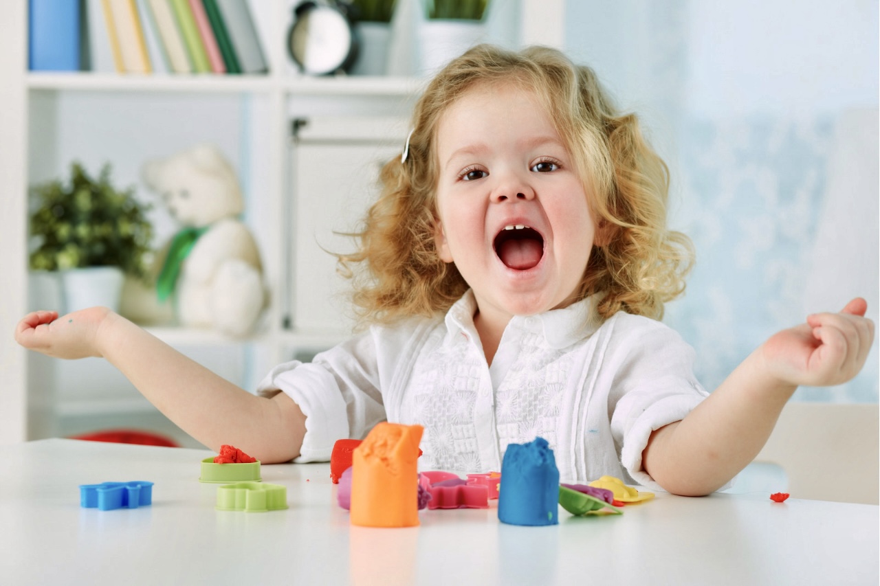 Girl flapping hands.
