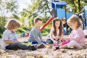 Children playing in sand.